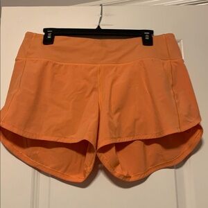 Lululemon Orange Speed Up Shorts, Sz 10, 4 in
Fair Condition
